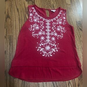 Dressbarn red sleeveless knit top with white embroidery.